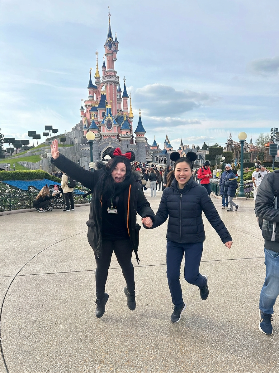Lourdes accompanying a client at Disneyland — joyful accessible travel