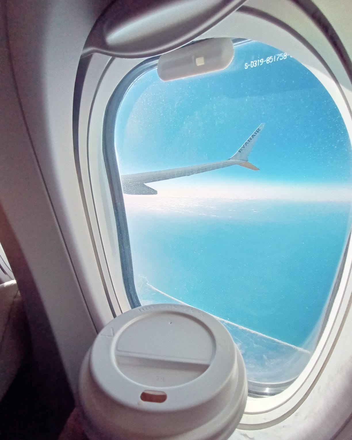 View through an aeroplane window — accompanied flights